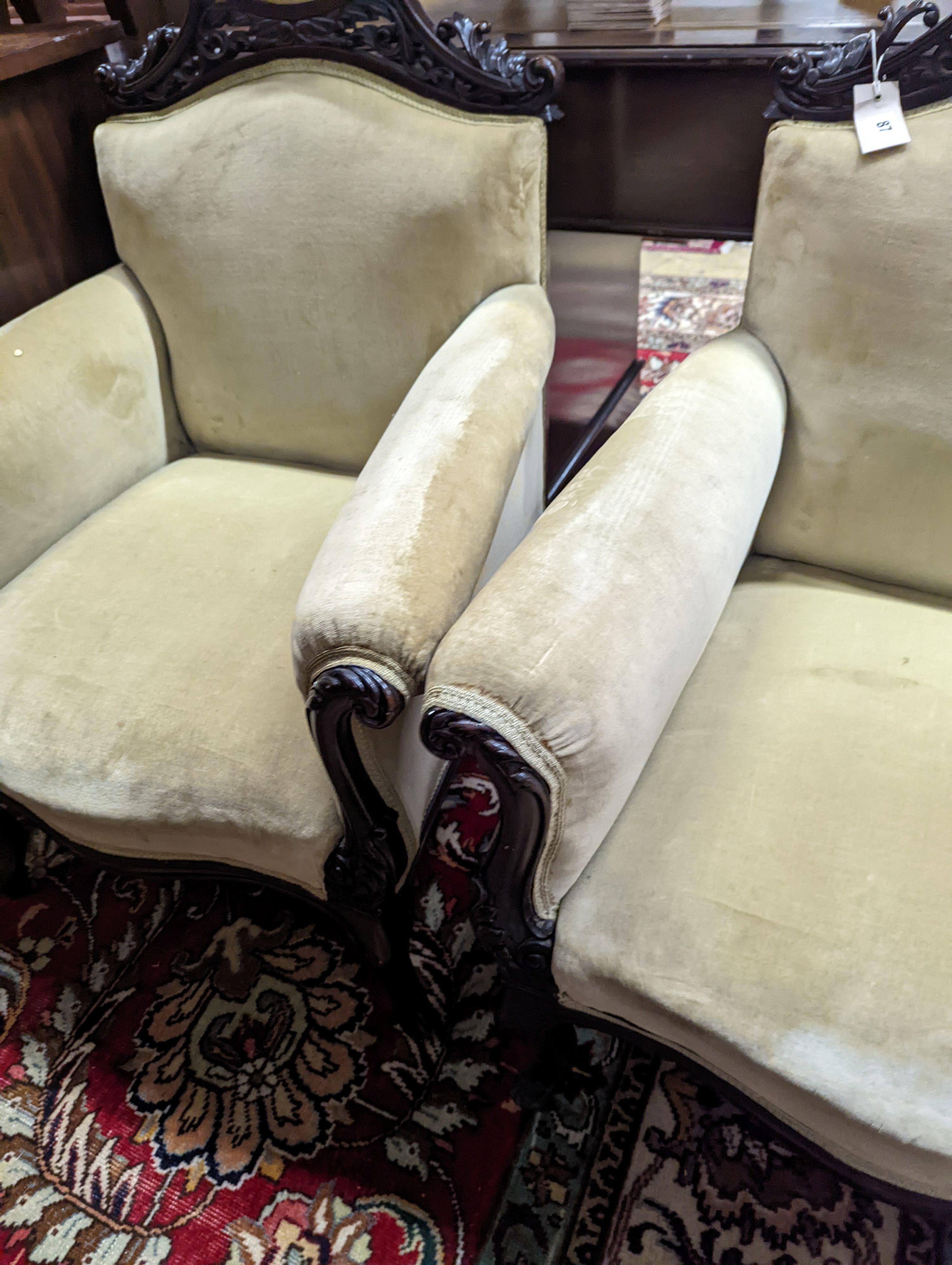 A late Victorian carved mahogany seven piece salon suite, settee length 140cm, depth 60cm, height 94cm